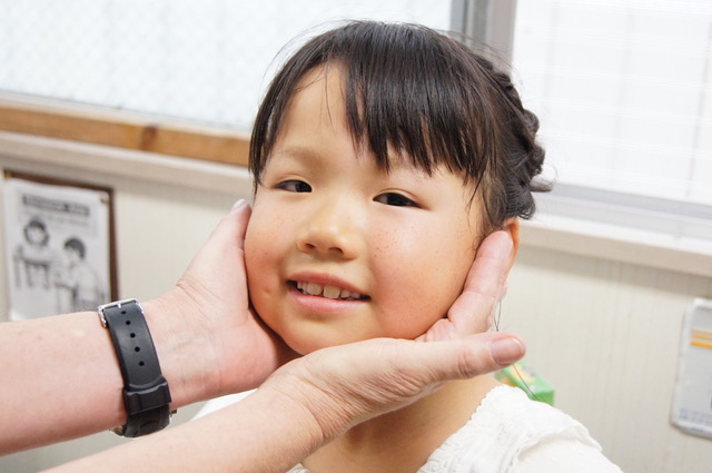 Holding child's face.jpeg